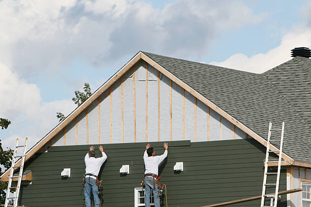 Professional Siding technician working in Russells Point, OH